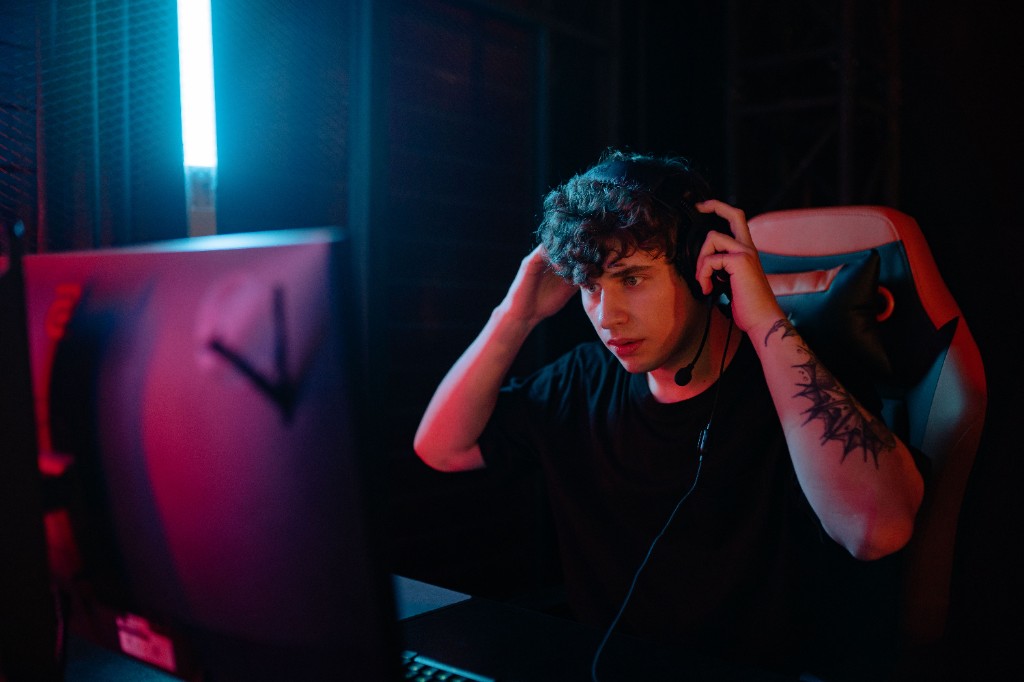Creator at a desk with a headset